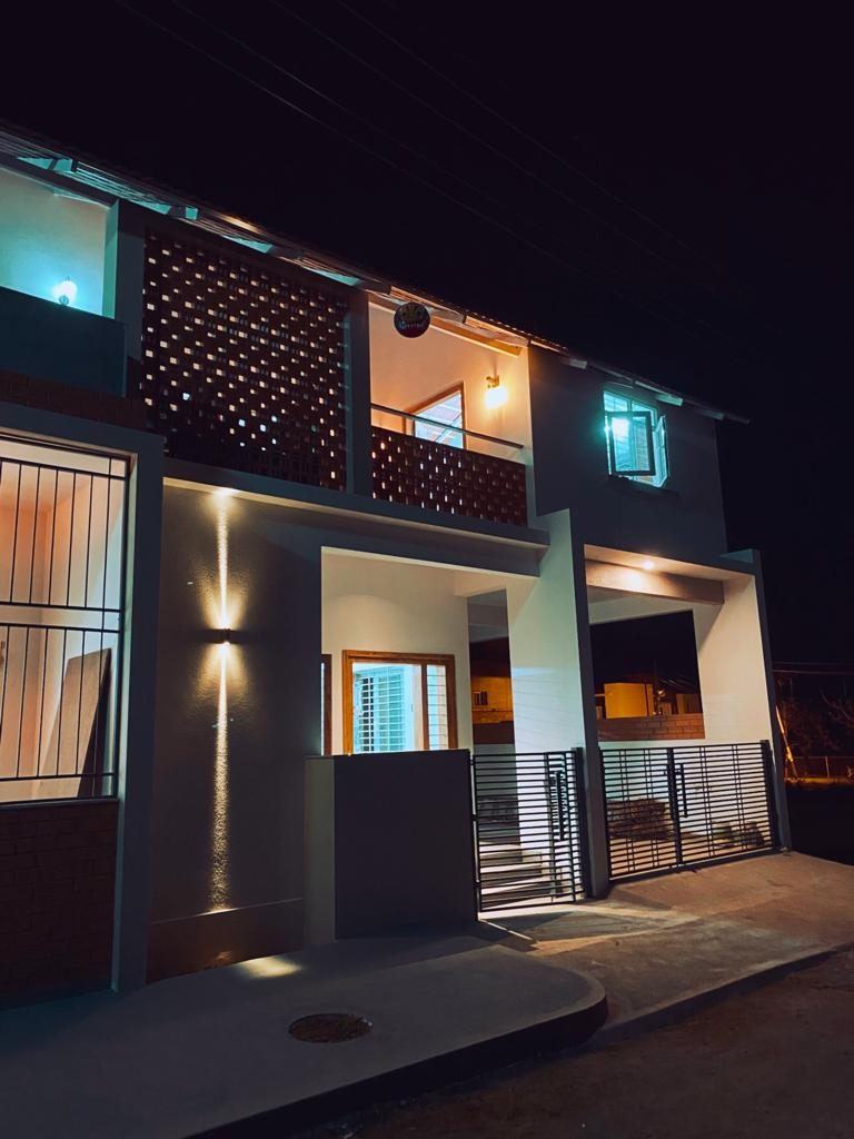 Lattice-screen house lit at night